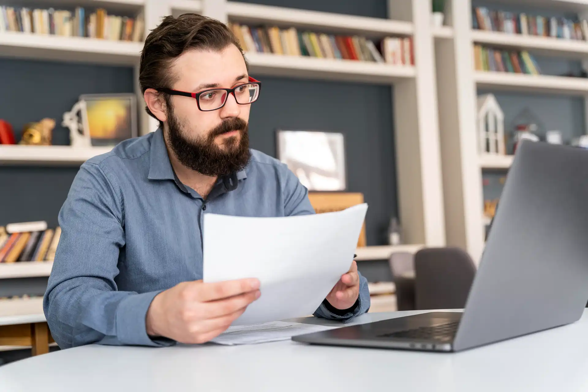 Graduate student working with document formatting tools to refine a thesis paper.