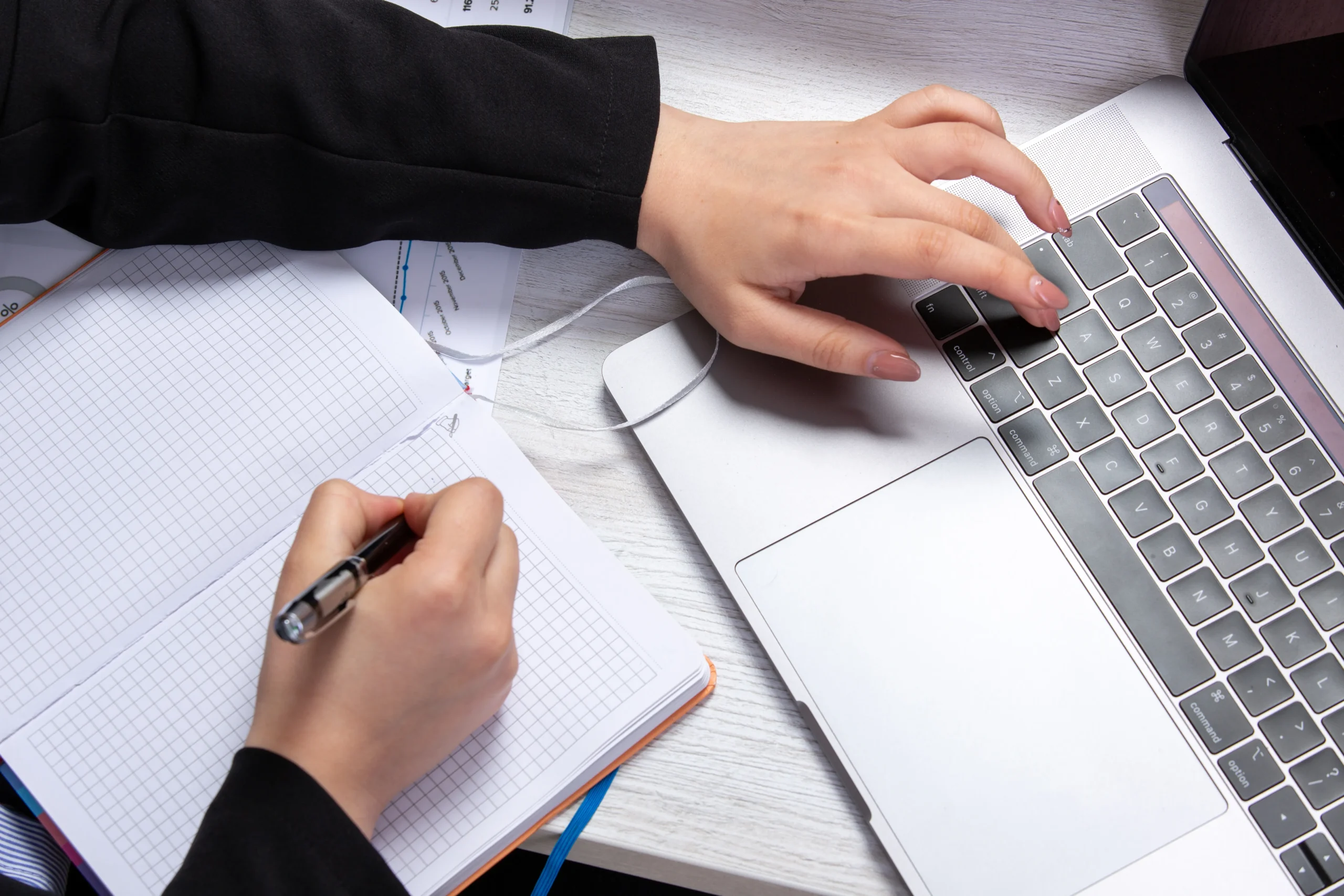 Doctoral student organizing research notes with help with writing assignments from an expert.