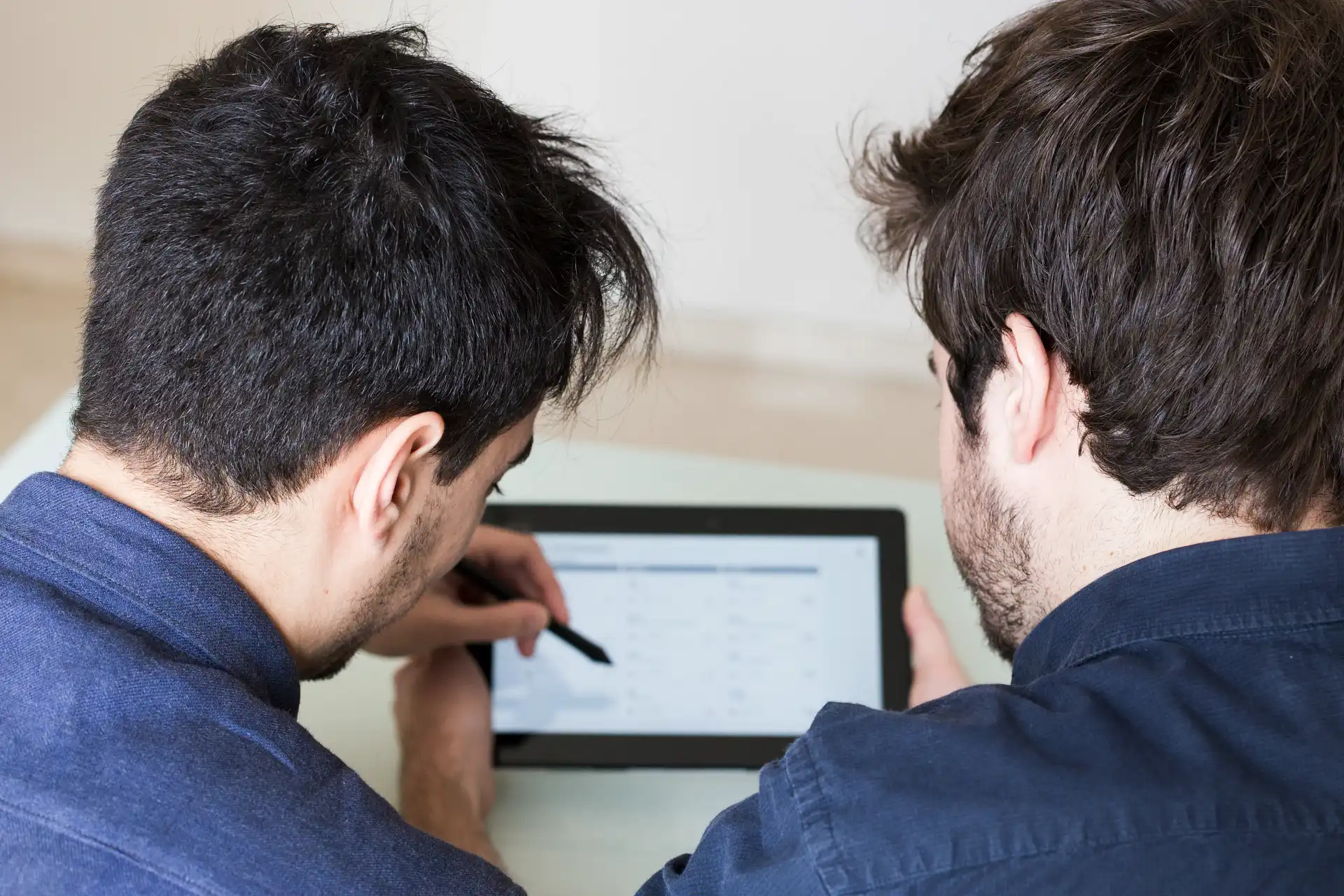 Professional analyst evaluating multiple research papers to perform systematic meta analysis research.