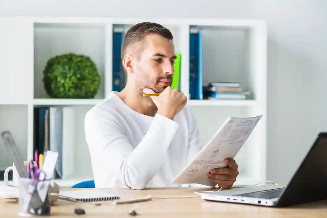 Scholar drafting a thesis chapter with guidance from professional dissertation writing services.